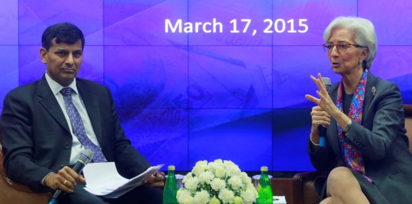 Managing Director of the IMF Christine Lagarde speaks as Governor of Reserve Bank of India Raghuram Rajan looks on during an event at the RBI headquarters in Mumbai, India, March 17, 2015. Lagarde was in the country on a two-day visit. (AP Photo/Rafiq Maqbool)
