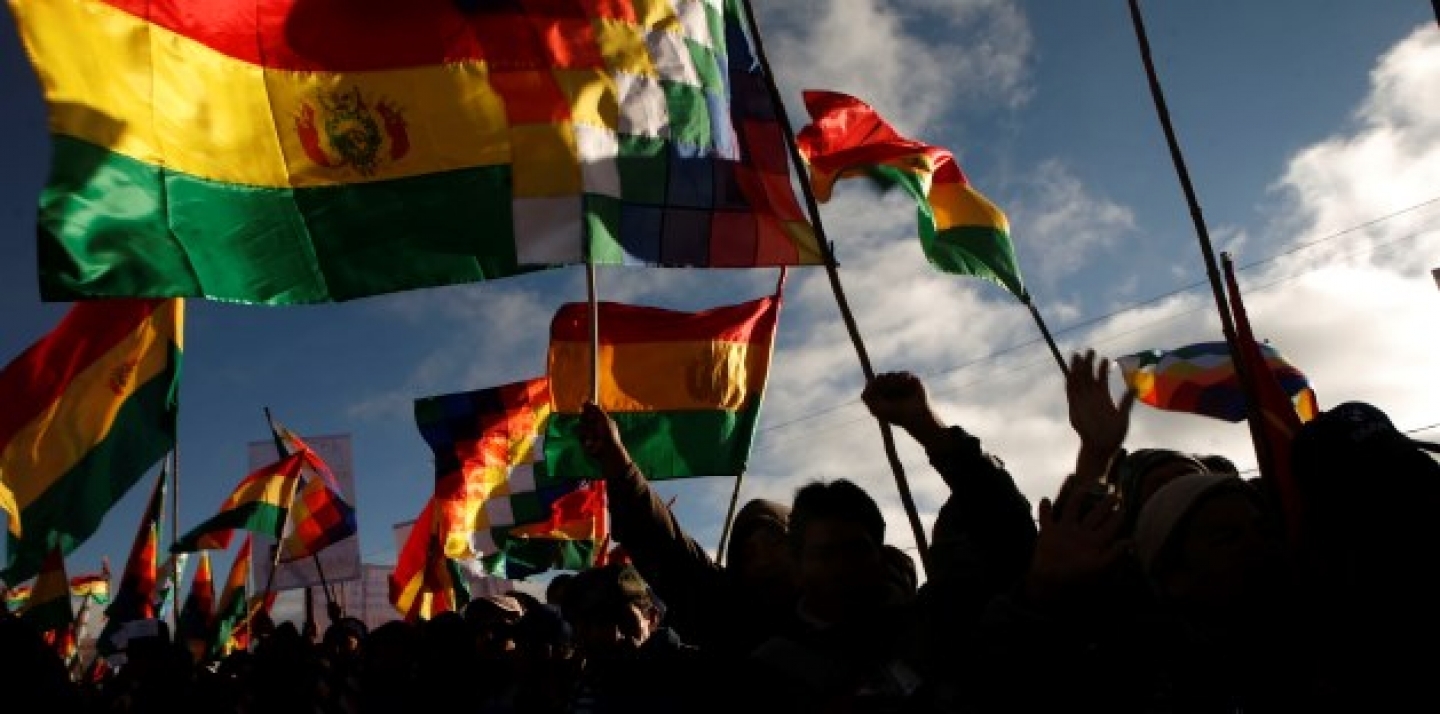 Supporters of Bolivia's President Evo Morales, holding up Bolivian flags. (AP Photo/Dado Galdieri)