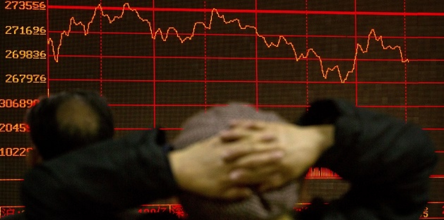 A Chinese investor monitors stock prices on an electronic display in a brokerage house in Beijing, Thursday, Jan. 28, 2016. Asian stock markets wavered Thursday after the Federal Reserve sounded a note of caution on the world economy and its effect on U.S. growth but left the door open for rate hikes. (AP Photo/Mark Schiefelbein)