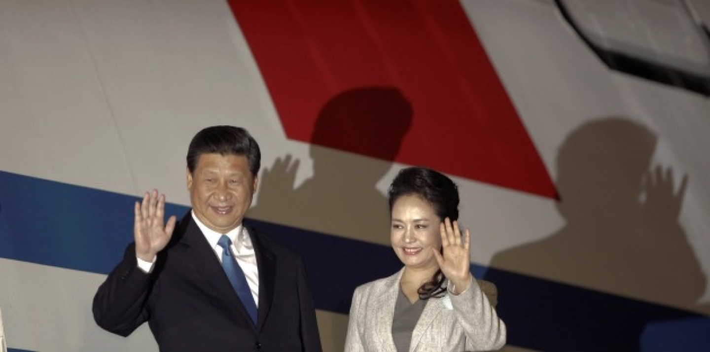 Chinese President Xi Jinping, left, and his wife Peng Liyuan wave to reporters upon their arrival to San Jose, Costa Rica. (AP Photo/Arnulfo Franco, File)