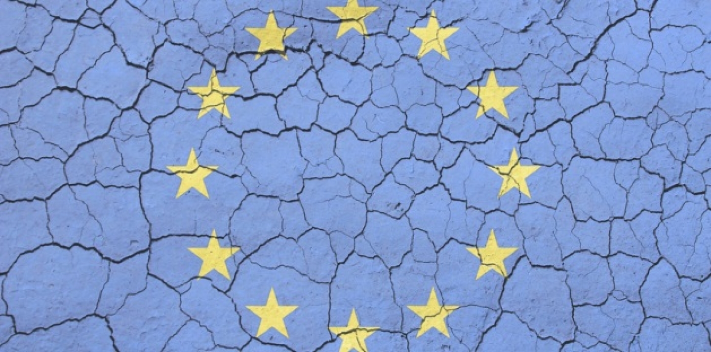 EU flag imposed on an image of cracking soil (AP Microstock).
