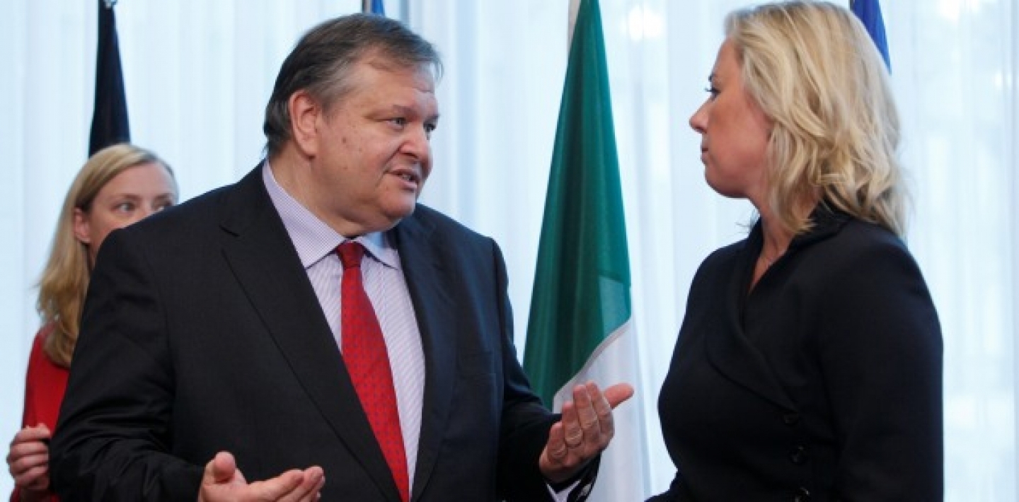 Greek Finance Minister Evangelos Venizelos, left, speaks with Finland's Finance Minister Jutta Urpilainen prior to signing a copy of the 'European Stability Mechanism' (AP Photo/Virginia Mayo)