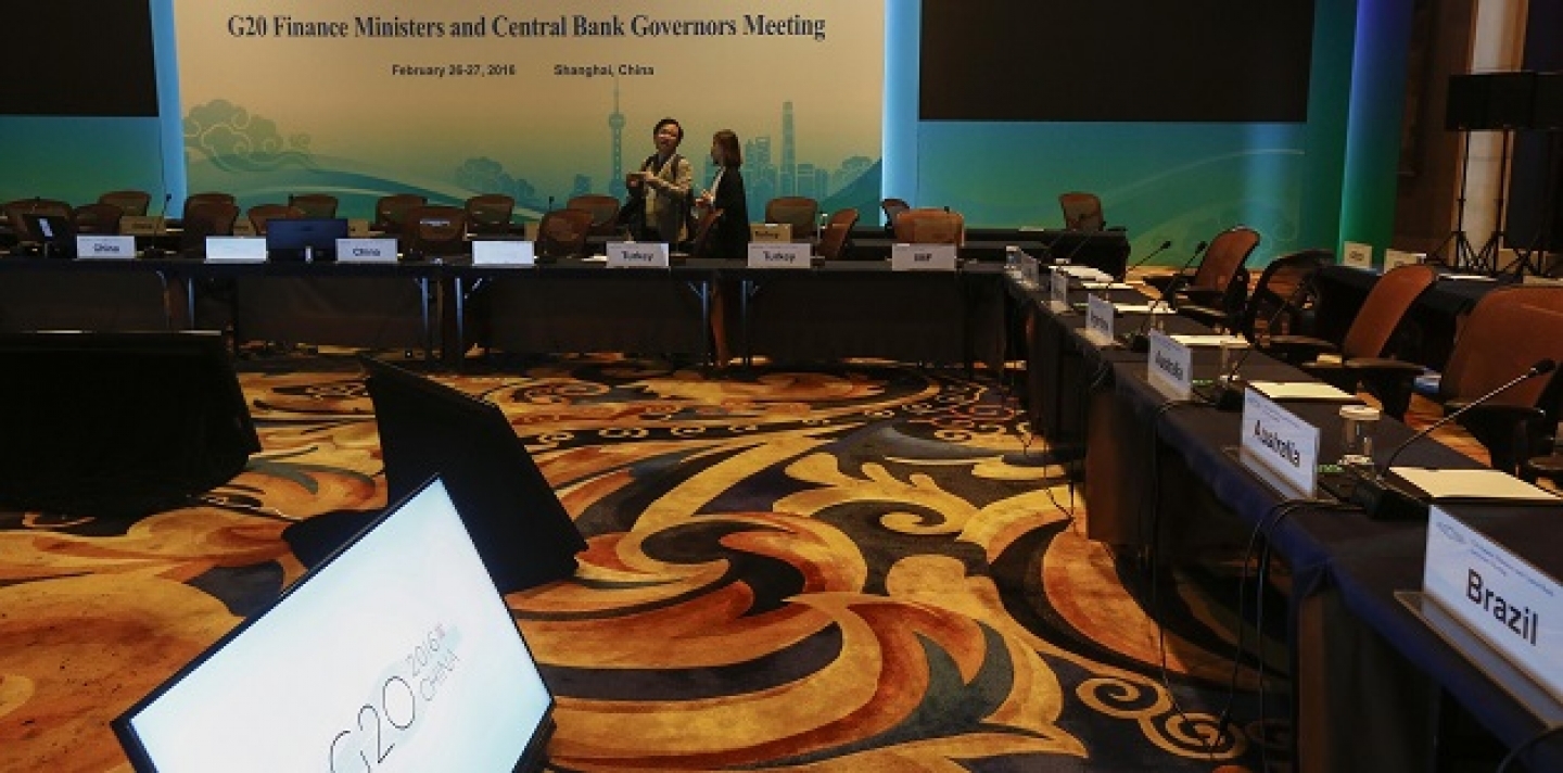 Chinese journalists view the meeting room one day before the start of the G20 Finance Ministers and Central Bank Governors Meeting at the Pudong Shangri-la Hotel in Shanghai, China, Thursday, Feb. 25, 2016. (Rolex Dela Pena/Pool via AP)