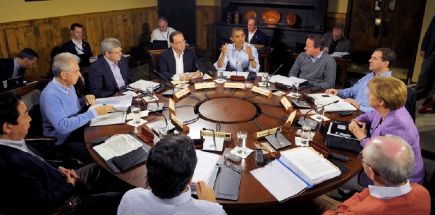 U.S. President Barack Obama, center, speaks at the start of the first working session of the G8 Summit at Camp David (AP Photo/Philippe Wojazer, Pool)