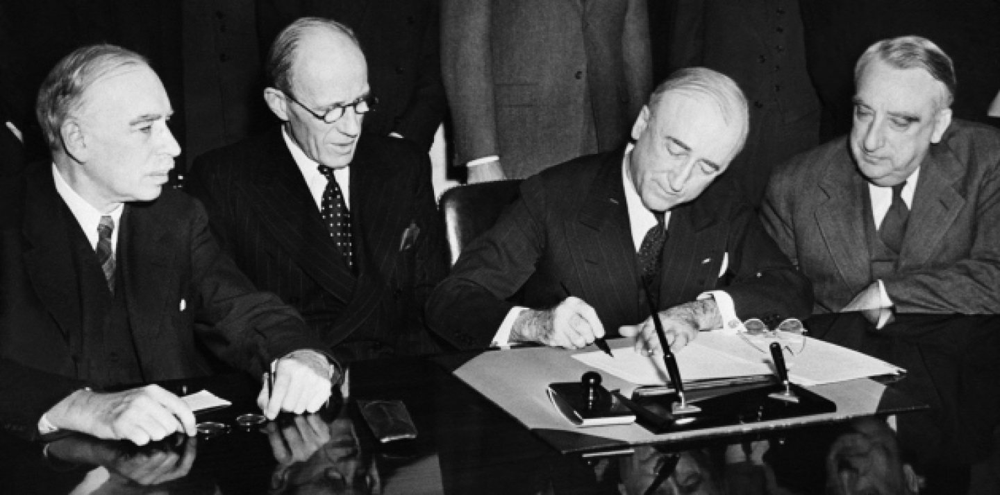 Secretary of State James F. Syrnes signs agreement for $4,400,000,000 loan to Great Britain by the United States during ceremony at State Department in Washington on June 12, 1945. (AP Photo)