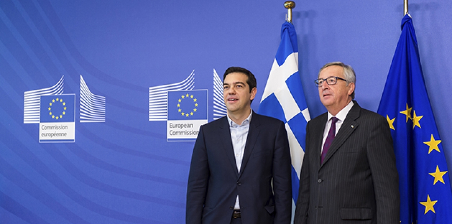 European Commission President Jean-Claude Juncker, right, stands with Greece's Prime Minister Alexis Tsipras upon his arrival at the European Commission headquarters in Brussels Wednesday, Feb. 4, 2015. (AP Photo/Geert Vanden Wijngaert)