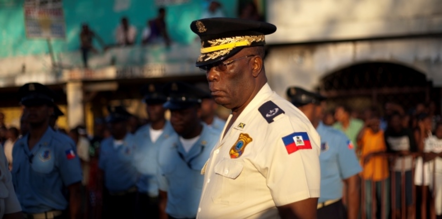 A director of the national police, and his troops stand guard as Haitians gather for a ceremony marking the 206th anniversary of the assassination of independence hero and founding father Jean-Jacques Dessalines (AP Photo/Dieu Nalio Chery)