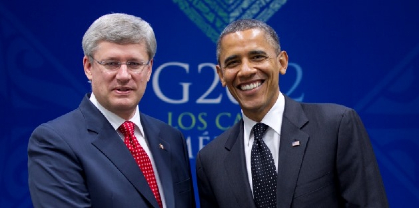 Prime Minister Stephen Harper poses with Barack Obama, President of the United States, after it was announced that Canada would join the Trans-Pacific Partnership. (AP Photo/Carolyn Kaster)