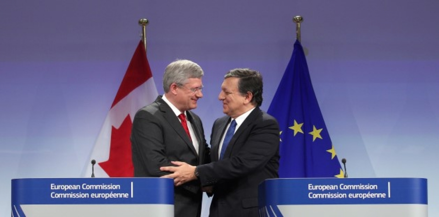 European Commission President Jose Manuel Barroso, right, shakes hands with Canada's Prime Minister Stephen Harper during a media conference at the European Commission headquarters in Brussels, Friday, Oct. 18, 2013. (AP Photo/Yves Logghe)