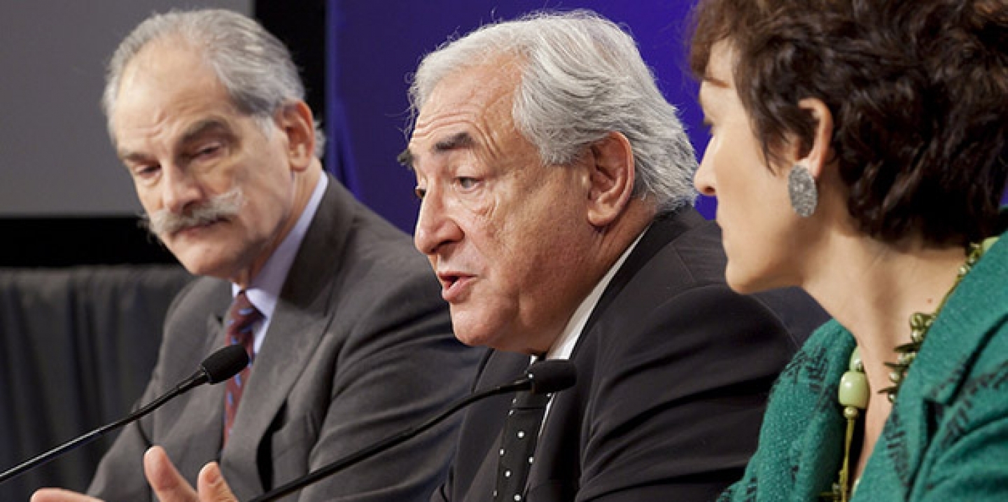 Dominique Strauss-Kahn (C), John Lipsky (L) and Caroline Atkinson (R) answers questions during his press conference October 7, 2010 at the IMF Headquarters in Washington, DC. (IMF Photograph/Stephen Jaffe)