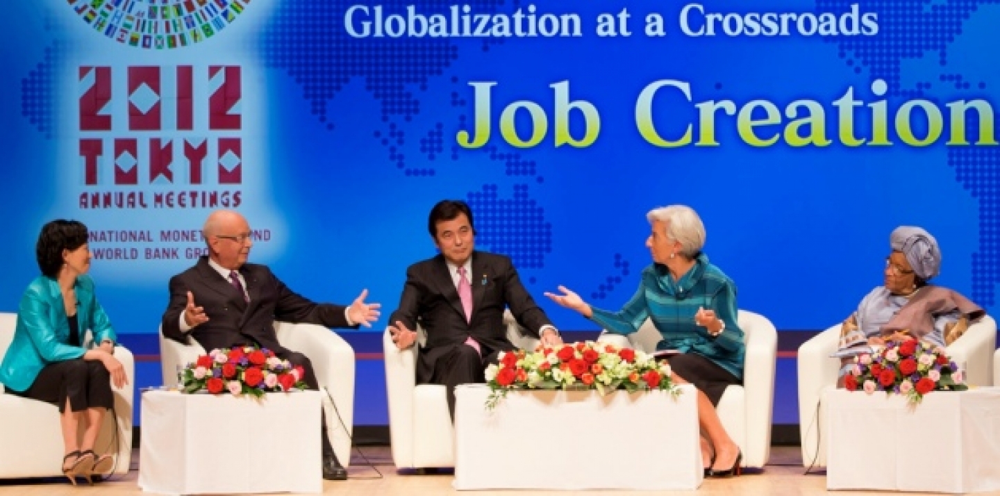IMF Managing Director Christine Lagarde, second right, speaks with World Economic Forum Founder and Executive Chairman Klaus Schwab, second left, as Japanese Finance Minister Koriki Jojima, centre, Liberian President Ellen Johnson Sirleaf, right, and Japanese public broadcaster NHK anchor Kaori Iida at the Tokyo meetings (AP Photo/Stephen Jaffe, IMF).