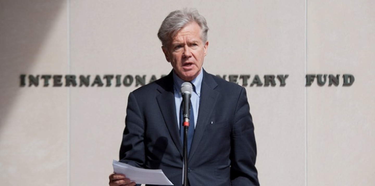 IMF Director of External Relations Gerry Rice makes a statement to the press regarding approved funding (about US$36.7 billion) under the EFF for Greece (March 15, 2012.). IMF via Flickr CC