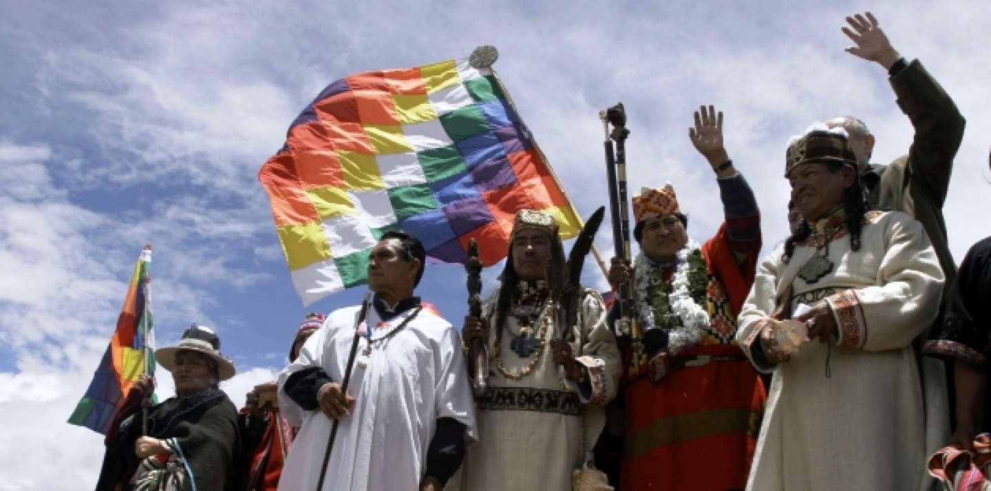 Holding the symbols of indigenous power, Bolivian President-elect Evo Morales, 2nd right, waves to supporters. (AP Photo/Dado Galdieri)