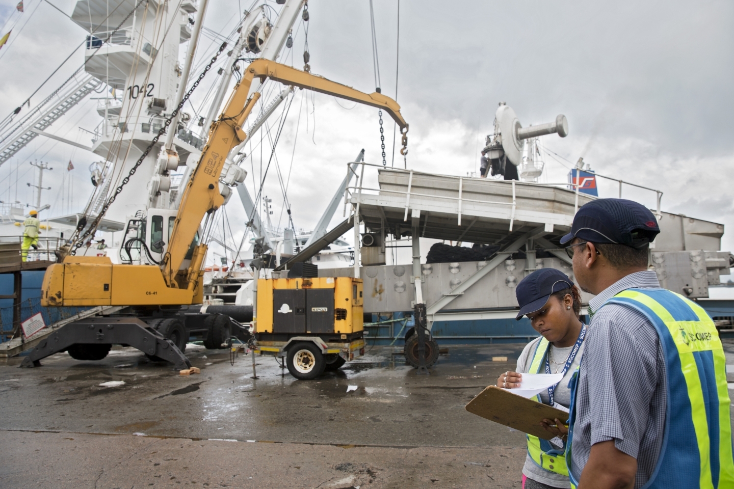 Nicole (left) is one of few women working on docks in Port Victoria, Seychelles. She works for SOCOMEP, an enterprise that provides services for the Seychelles’ largest industry: tuna fishing. (UN Women/Ryan Brown)