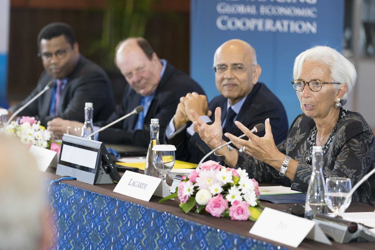 International Monetary Fund Managing Director Christine Lagarde speaks at the Bretton Woods Committee on October 10, 2018 in Bali, Indonesia. Masood Ahmed, president of Center for Global Development and Thomas Bernes, a distinguished fellow at CIGI sit to her left. (IMF Staff Photo/Stephen Jaffe)