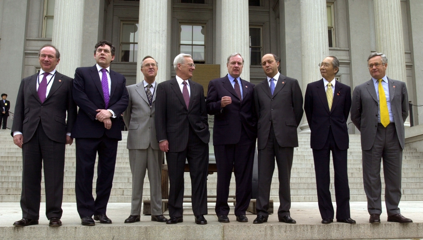 Group of Seven finance ministers gather on the steps of the US Treasury Department on April 20, 2002, in Washington. (AP Photo/Kenneth Lambert)