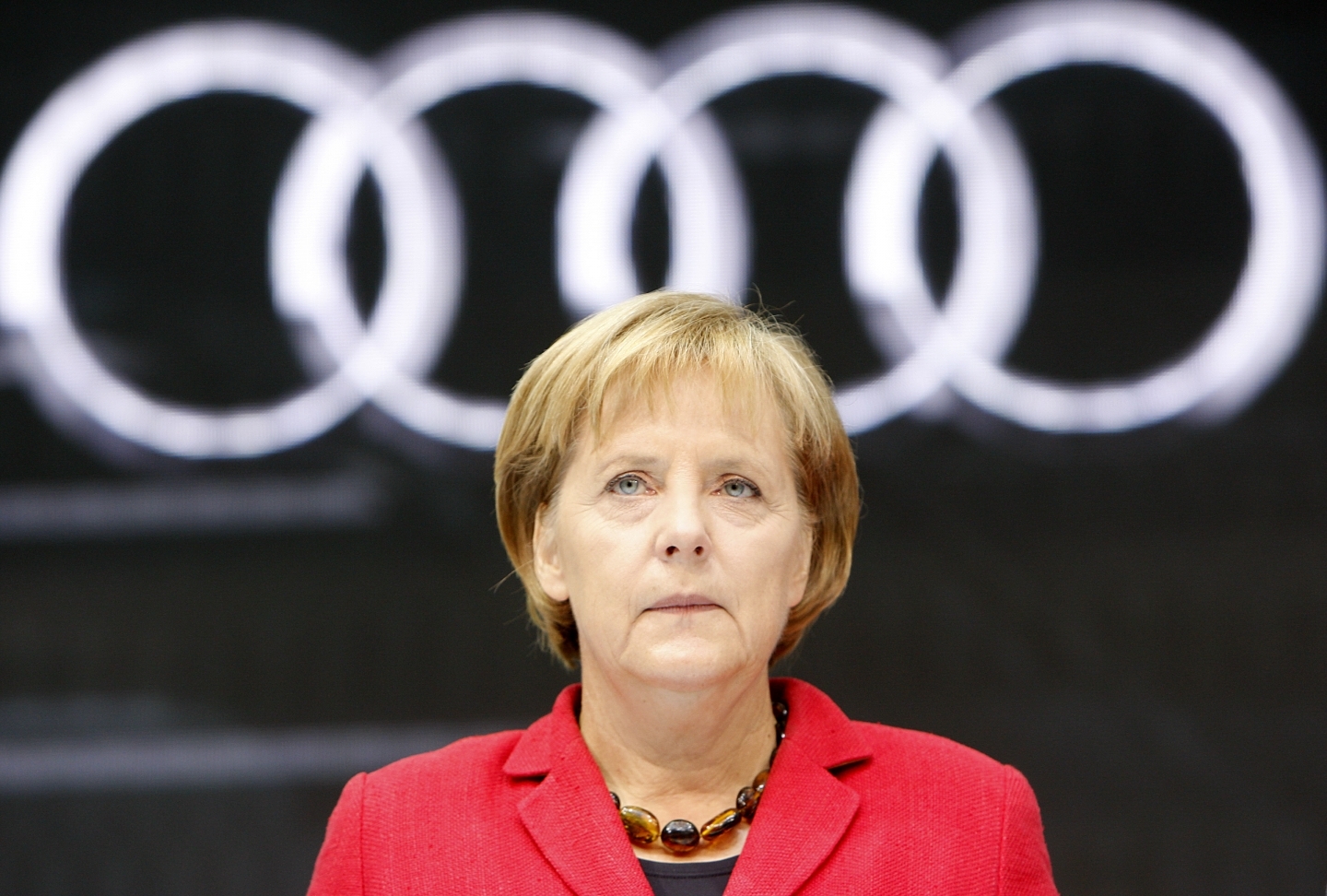 German Chancellor Angela Merkel stands in front of the Audi booth at the Frankfurt Auto Fair. (AP Photo/Frank Augstein)