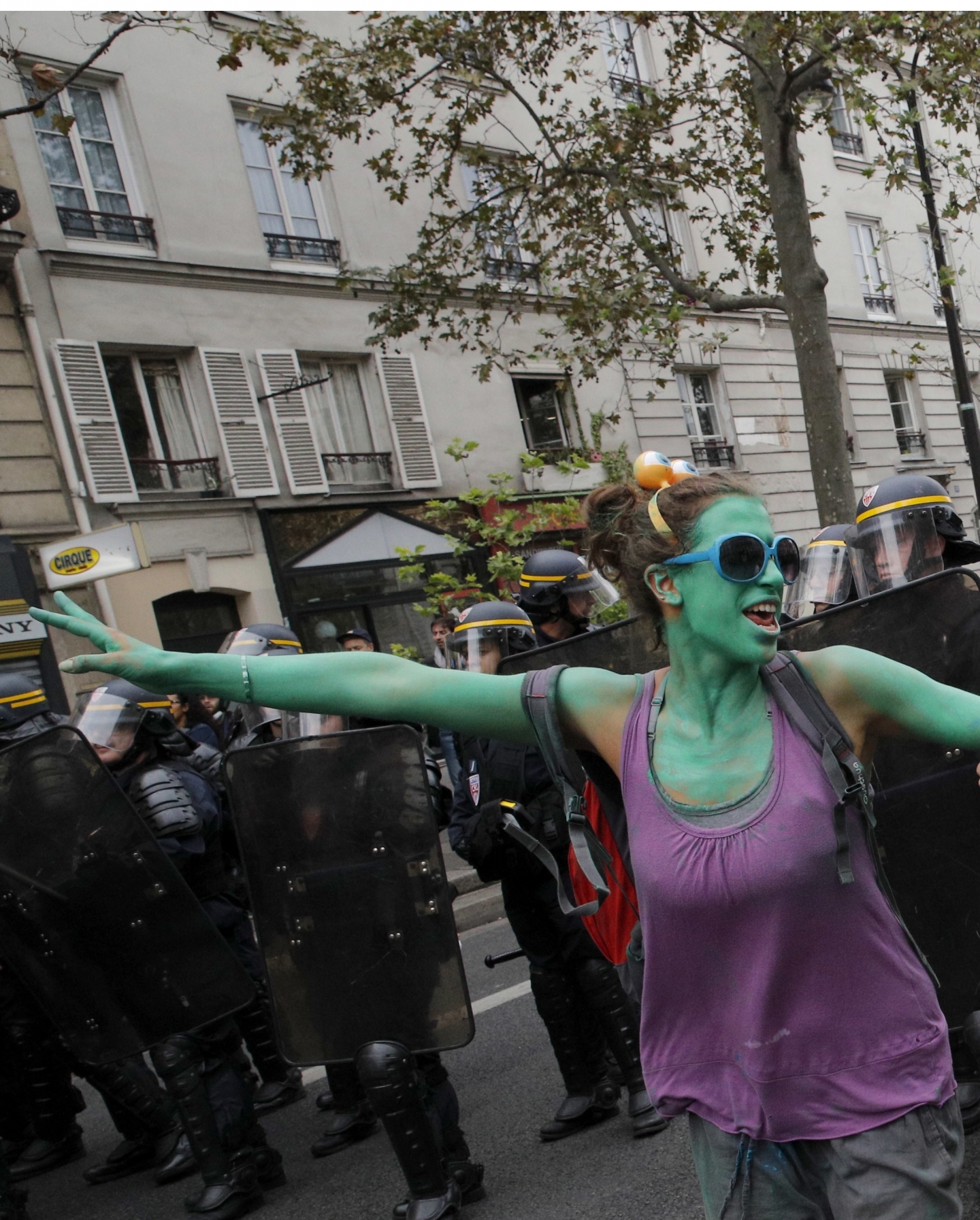 Demonstrators dance next to riot policemen during clashes in Paris over labor reforms (AP Photo/Christophe Ena)