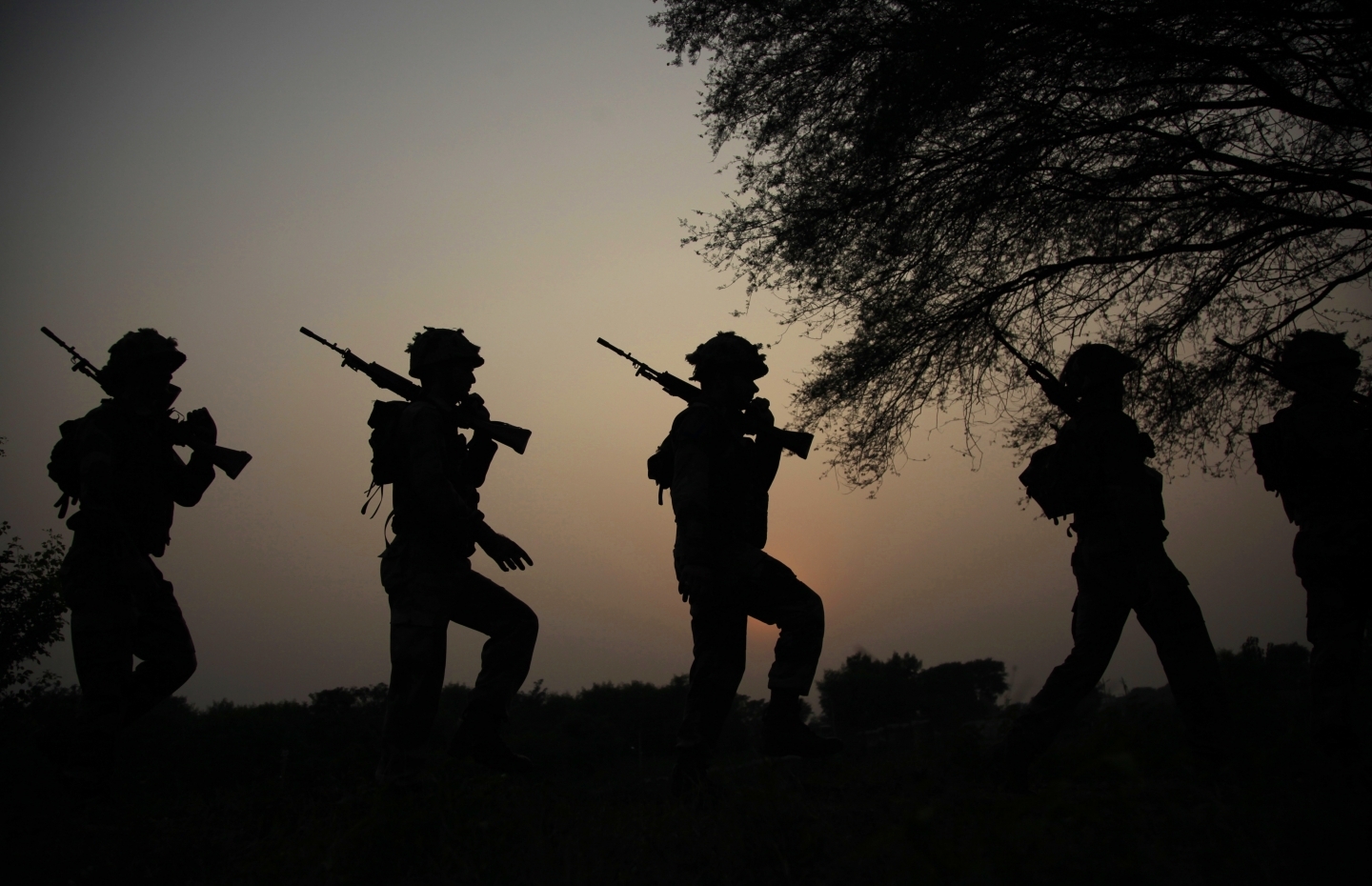 Soldiers patrol the India-Pakistan border (AP Photo/Channi Anand)