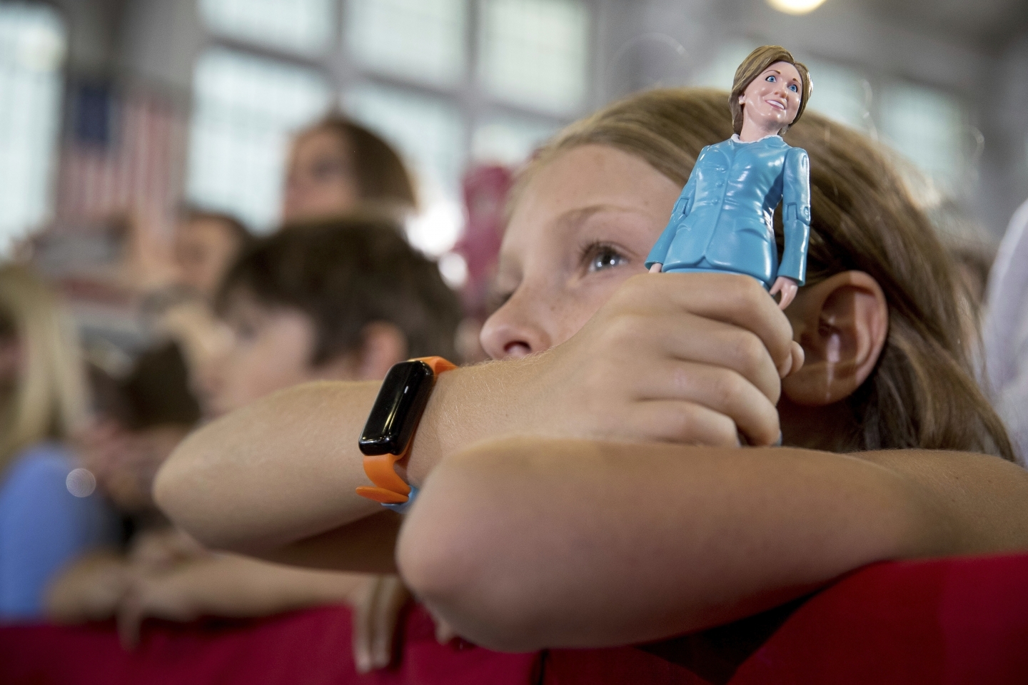 A girl in the audience holds a figurine at a rally in Akron, Ohio (AP Photo/Andrew Harnik)