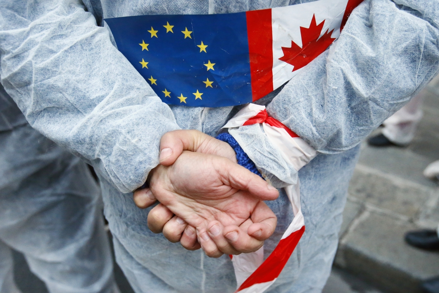 An activist protests the EU trade deal with Canada (AP Photo/Francois Mori)