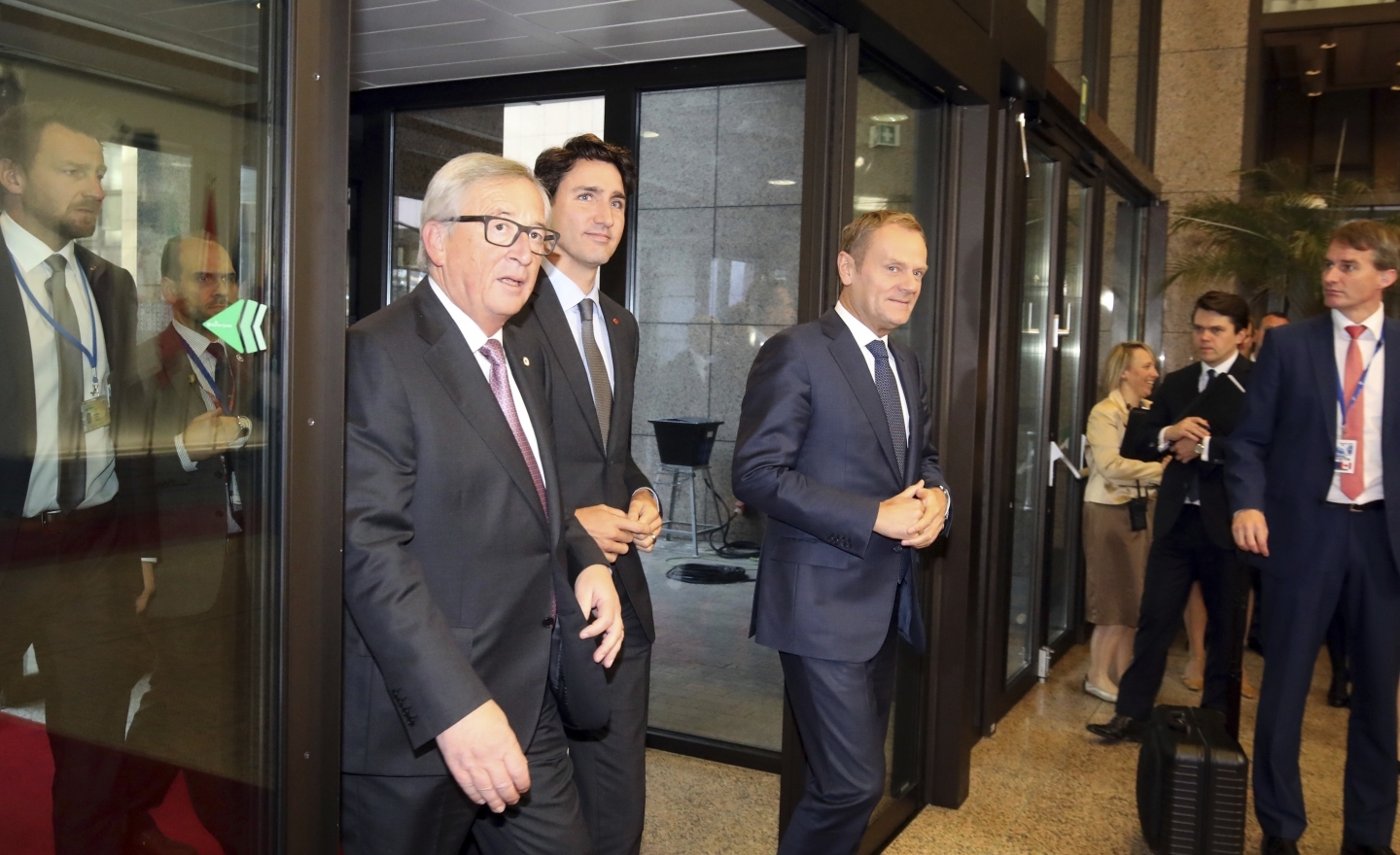 Canadian Prime Minister Justin Trudeau, left, European Commission President Jean-Claude Juncker, center, and European Council President Donald Tusk, right (AP Photo/Olivier Matthys)
