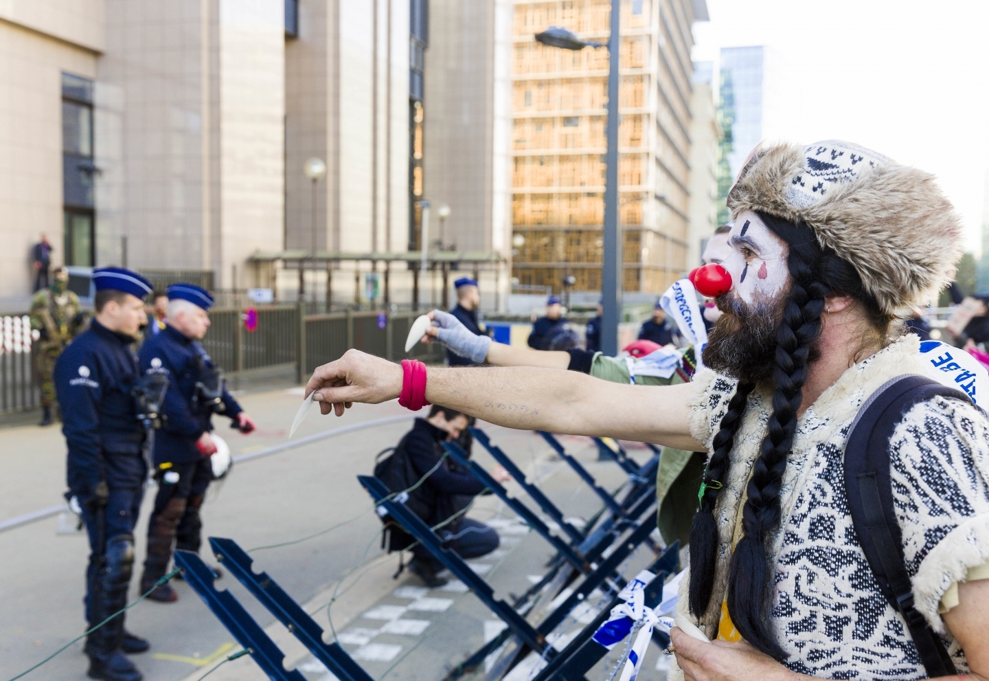 A demonstrator dressed as a clown outside of an EU-Canada summit in Brussels (AP Photo/Geert Vanden Wijngaert)