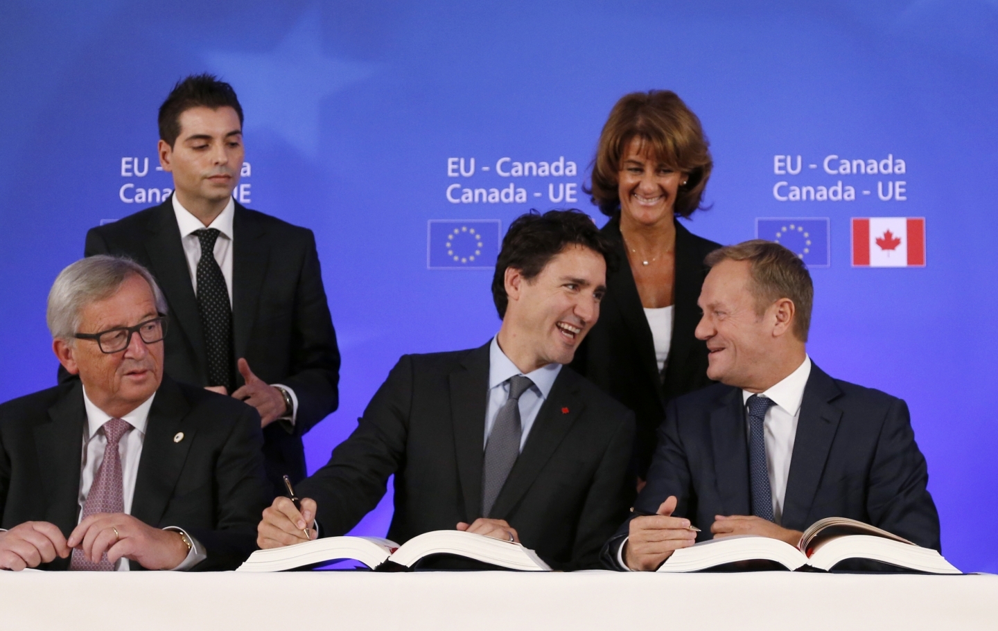 Prime Minister Justin Trudeau sits with European Council President Donald Tusk as they sign the Comprehensive Economic and Trade Agreement (CETA). (Francois Lenoir/AP Photo)