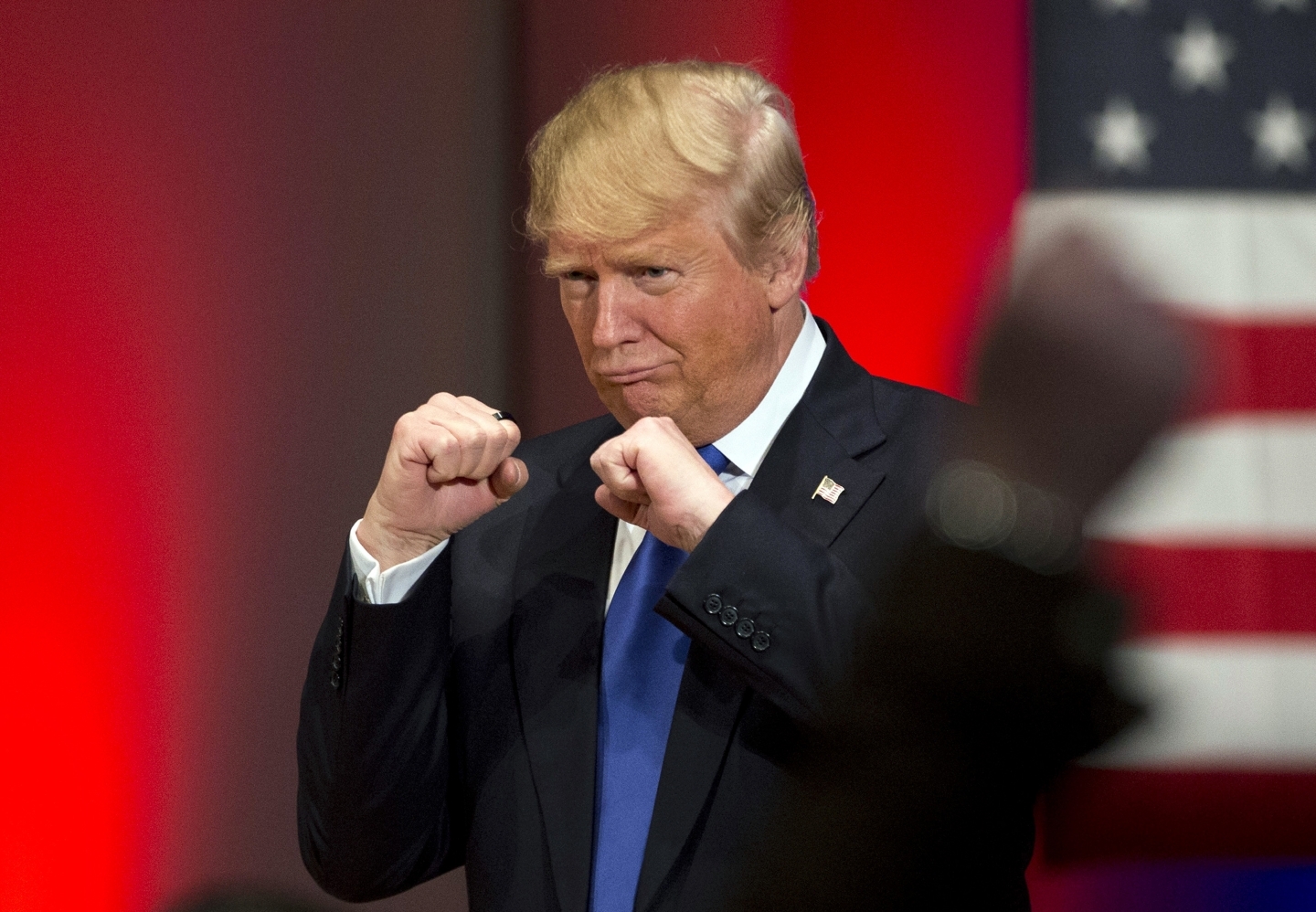 Donald Trump poses with a ring given to him by a group of veterans (AP Photo/Jae C. Hong, File)