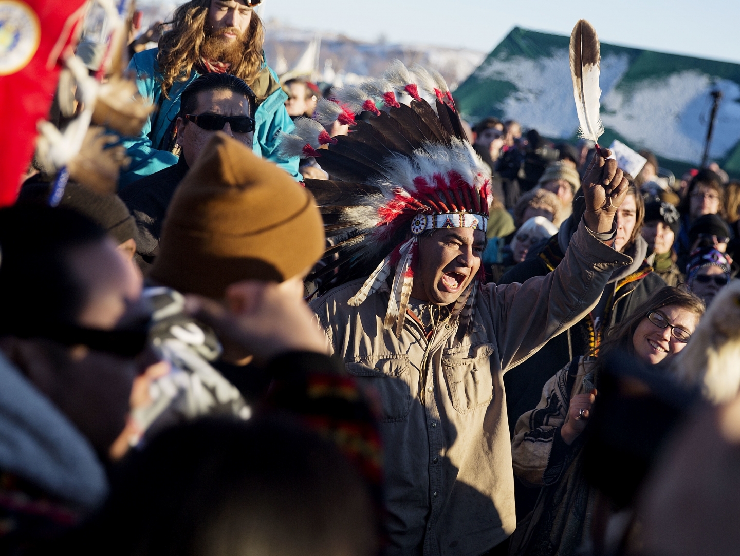 A crowd gathers in celebration at the Oceti Sakowin camp (AP Photo/David Goldman)