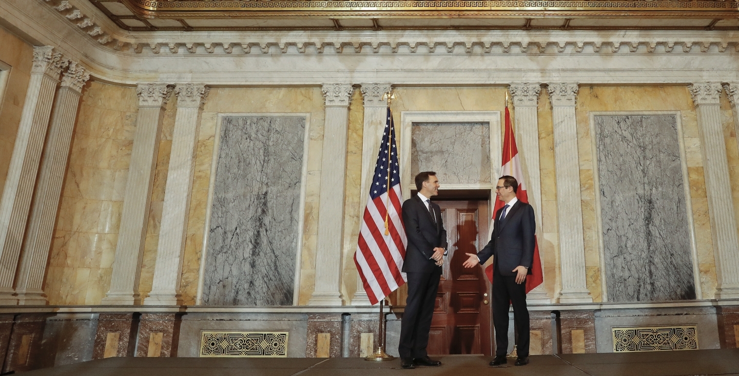 US Treasury Secretary Steven Mnuchin talks with Canadian Finance Minister William Morneau on March 1, 2017. (AP Photo/Pablo Martinez Monsivais)