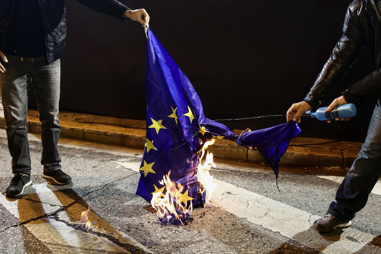 An anti-austerity rally outside an Athens hotel where IMF, EU and Greek officials hold talks (AP Photo/Yorgos Karahalis)