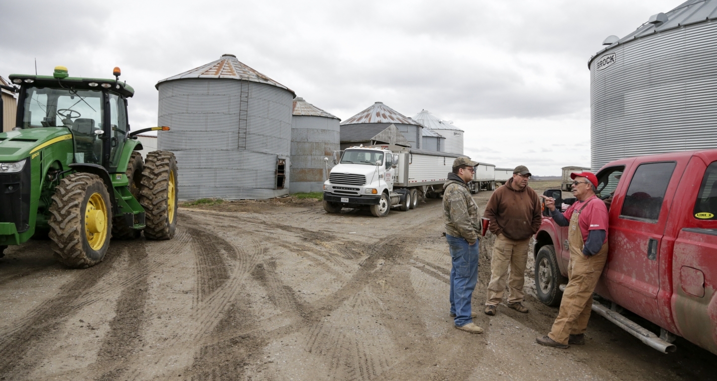 Blake Hurst, a farmer and president of the Missouri Farm Bureau, right, talks with his son and brother. The US farm lobby has been an influential voice on NAFTA talks (AP Photo/Nati Harnik)