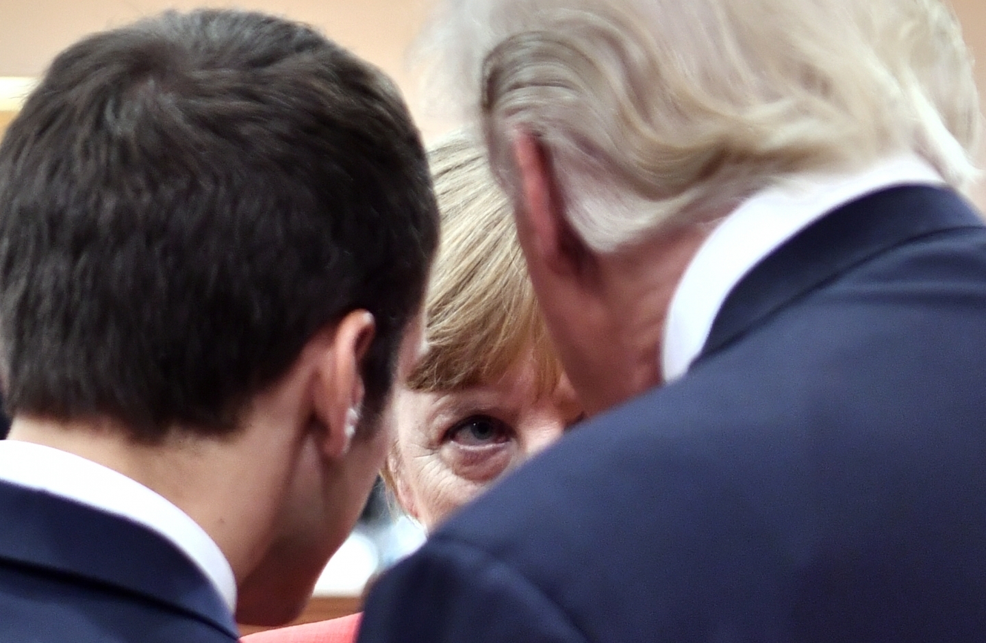 French President Emmanuel Macron, German Chancellor Angela Merkel and US President Donald Trump in Hamburg (John MacDougall/Pool Photo via AP)