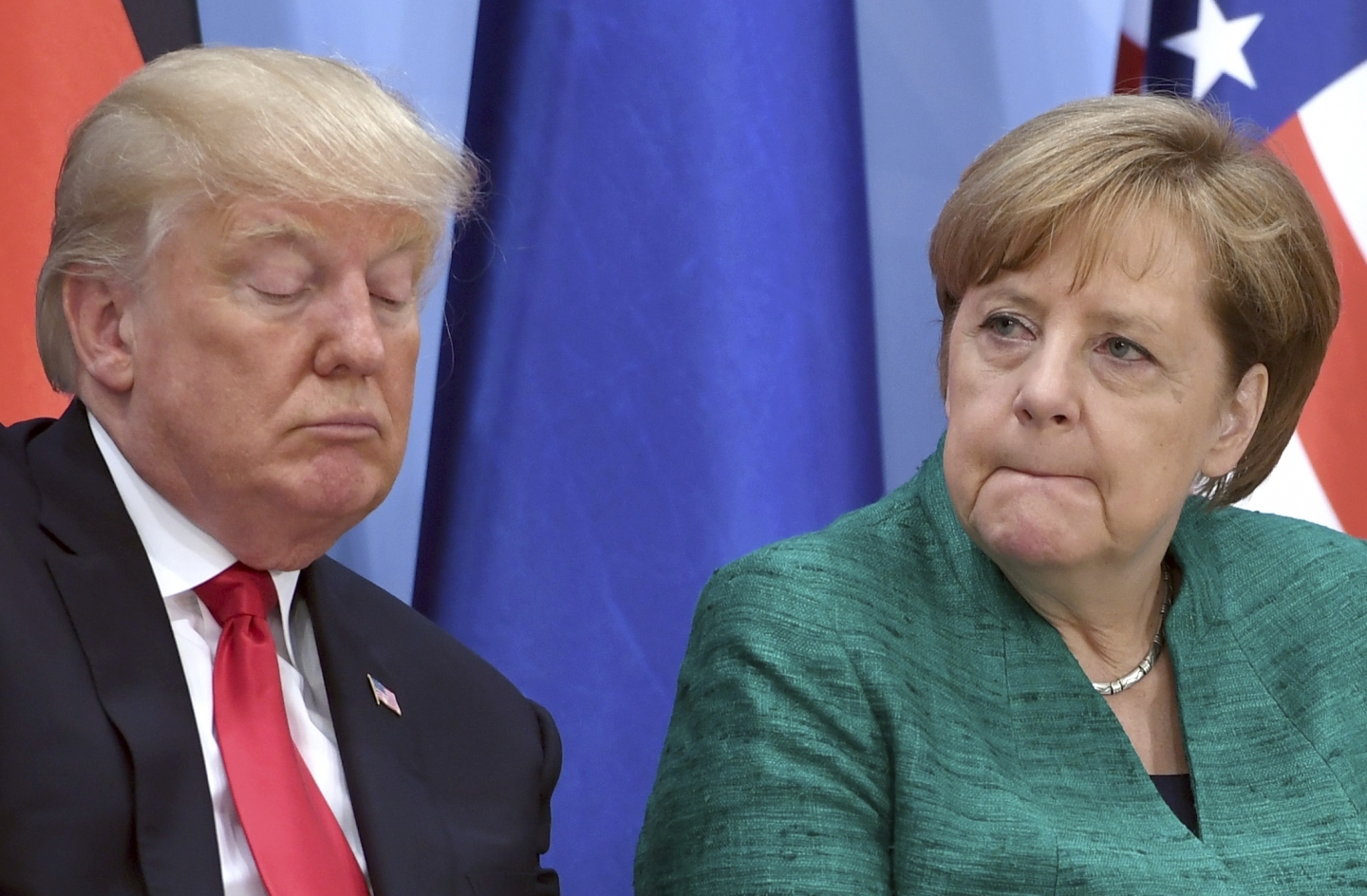 US President Donald Trump and German Chancellor Angela Merkel (Michael Kappeler/Pool Photo via AP)