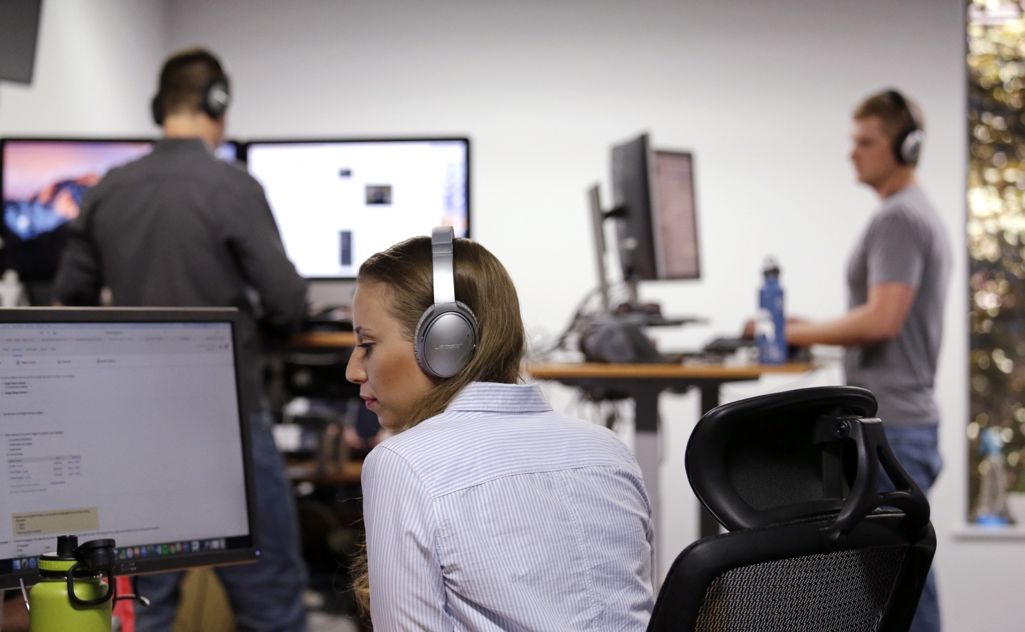 A woman works at her computer. (AP Photo/Elaine Thompson)