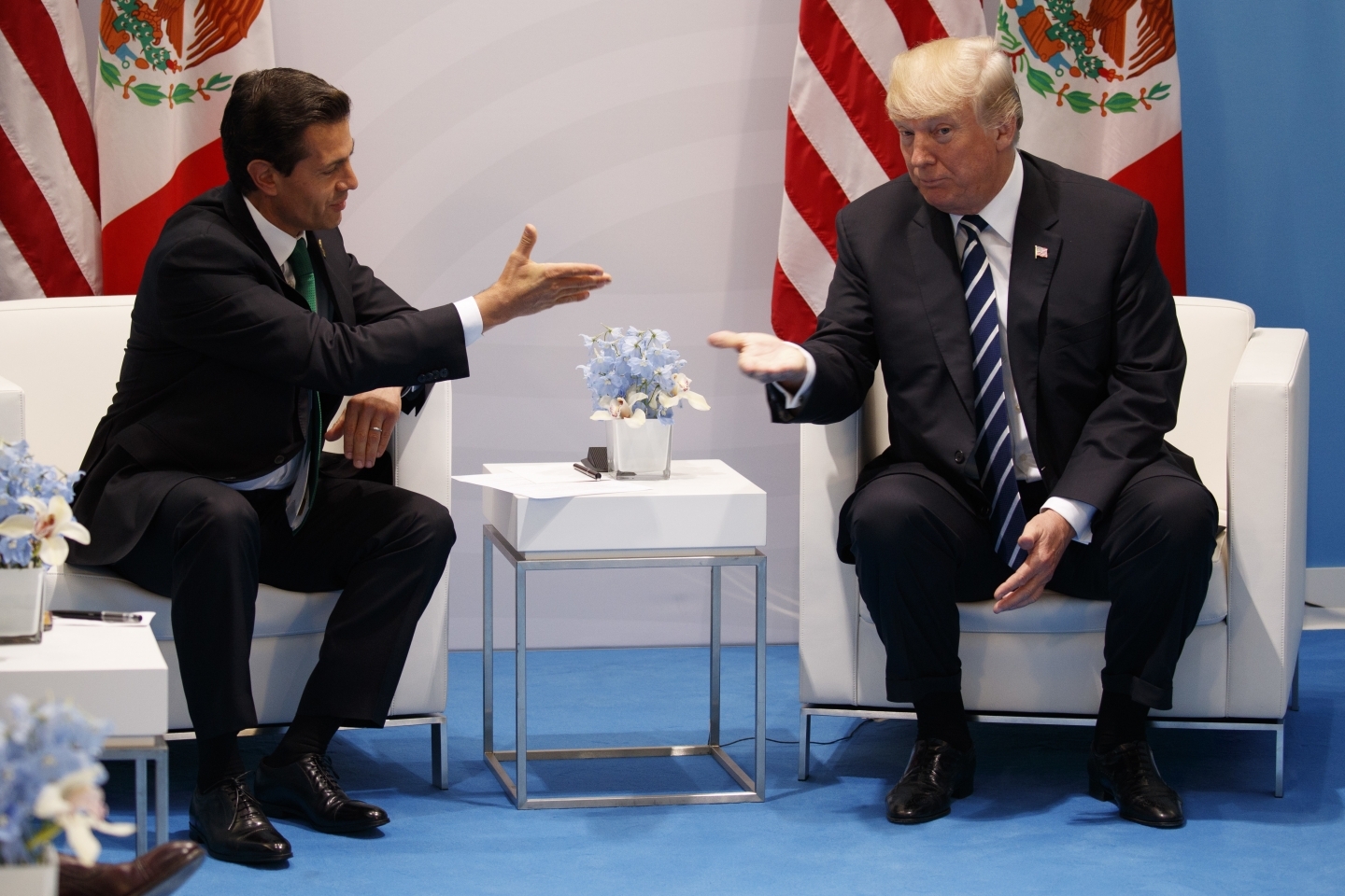US President Donald Trump meets with Mexican President Enrique Pena Nieto at the G20 Summit, in Hamburg, July 7, 2017 (AP Photo/Evan Vucci, File)
