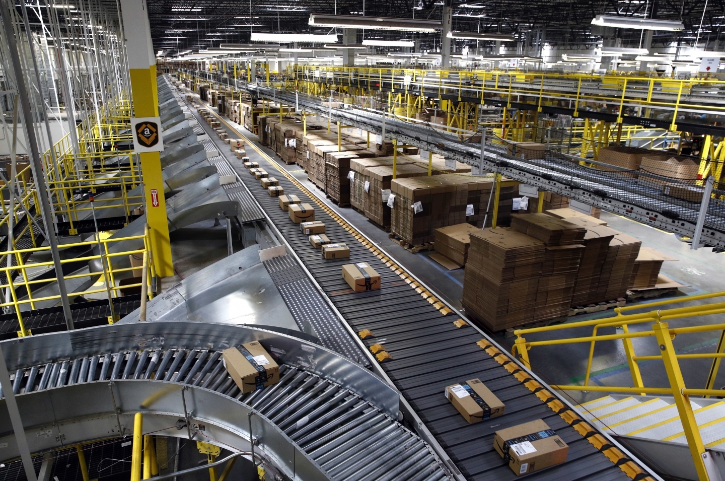 Packages ride on a conveyor system at an Amazon fulfillment center in Baltimore. (AP Photo/Patrick Semansky)