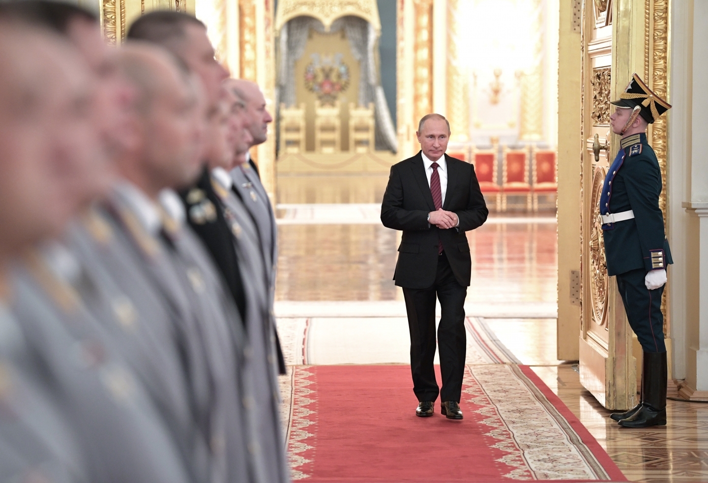Russian President Vladimir Putin walks in a hall during a meeting with senior military officers in the Kremlin. (Alexei Nikolsky, Kremlin Pool Photo via AP)