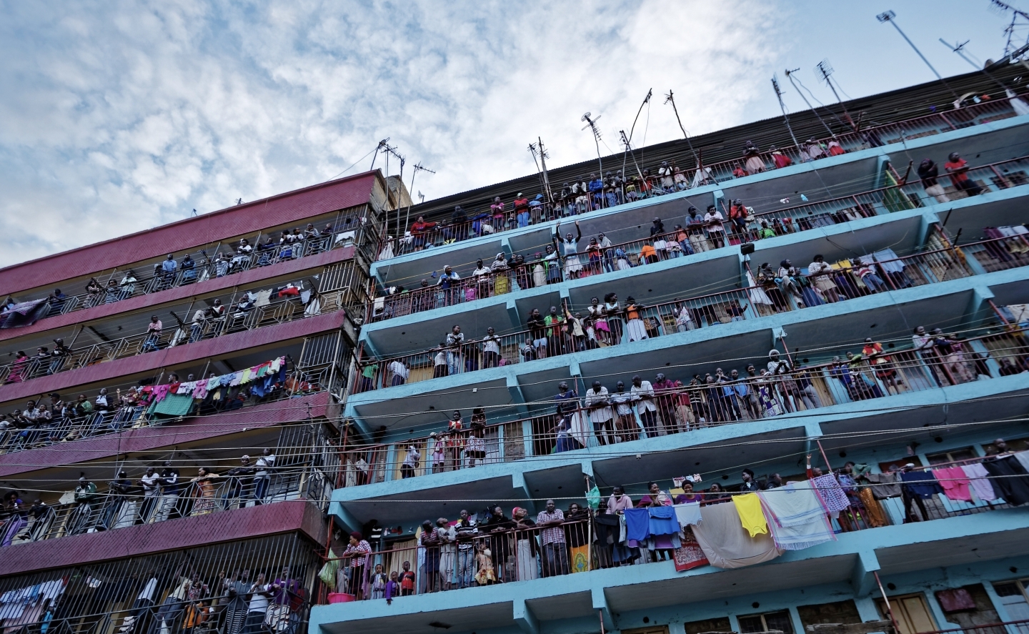 Residents watch as opposition protesters erect barricades before clashing with police after the election result was announced, in the Mathare slum of Nairobi, Kenya, October 30, 2017. (AP Photo/Ben Curtis)