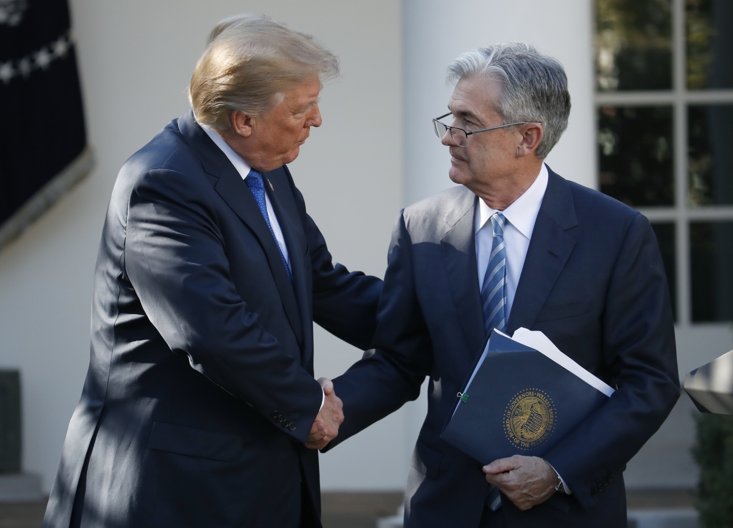 President Donald Trump shakes hands with Federal Reserve board member Jerome Powell after announcing him as his nominee for the next chair of the Federal Reserve, Thursday, Nov. 2, 2017. (AP Photo/Alex Brandon)