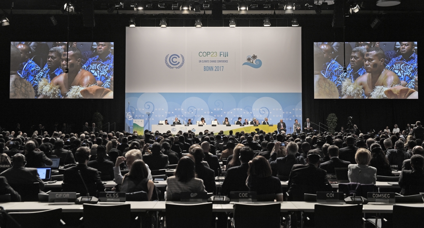 People from Fiji sit in the convention center during the opening of the COP23 Fiji UN Climate Change Conference in Bonn, Germany, Monday, Nov. 6, 2017. (AP Photo/Martin Meissner)
