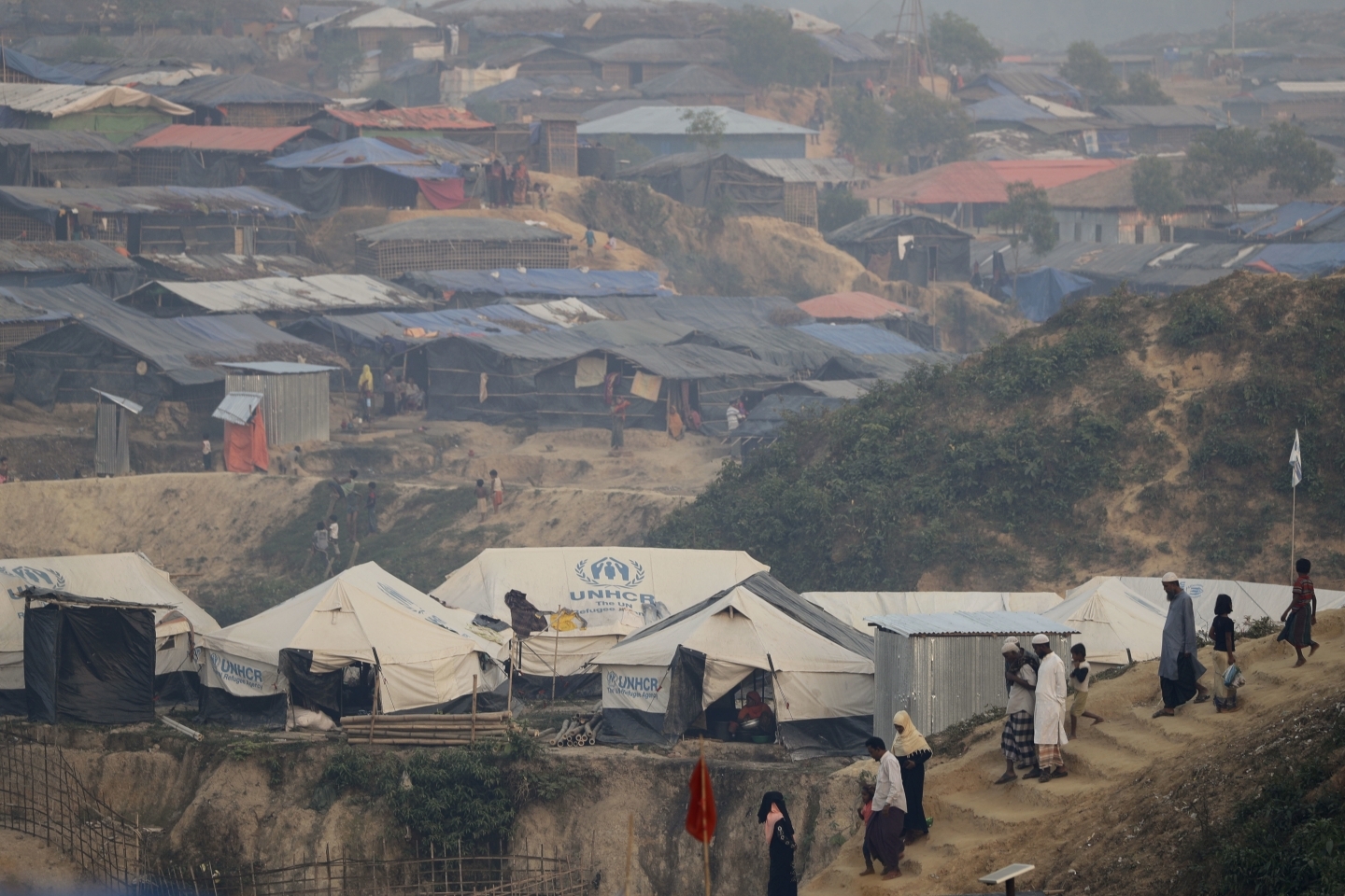 Rohingya Muslim men and women walk through Kutupalong refugee camp in Bangladesh. (AP Photo/Wong Maye-E)