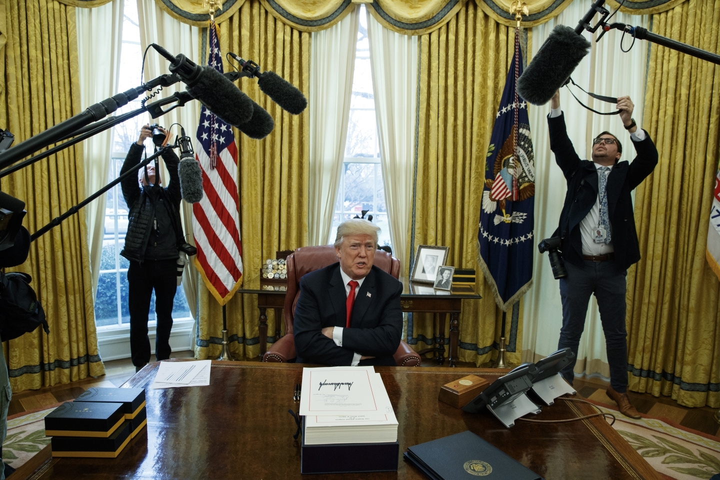 President Donald Trump signed the tax bill and the continuing resolution to fund the government on Friday, Dec. 22, 2017 in Washington. (AP Photo/Evan Vucci)