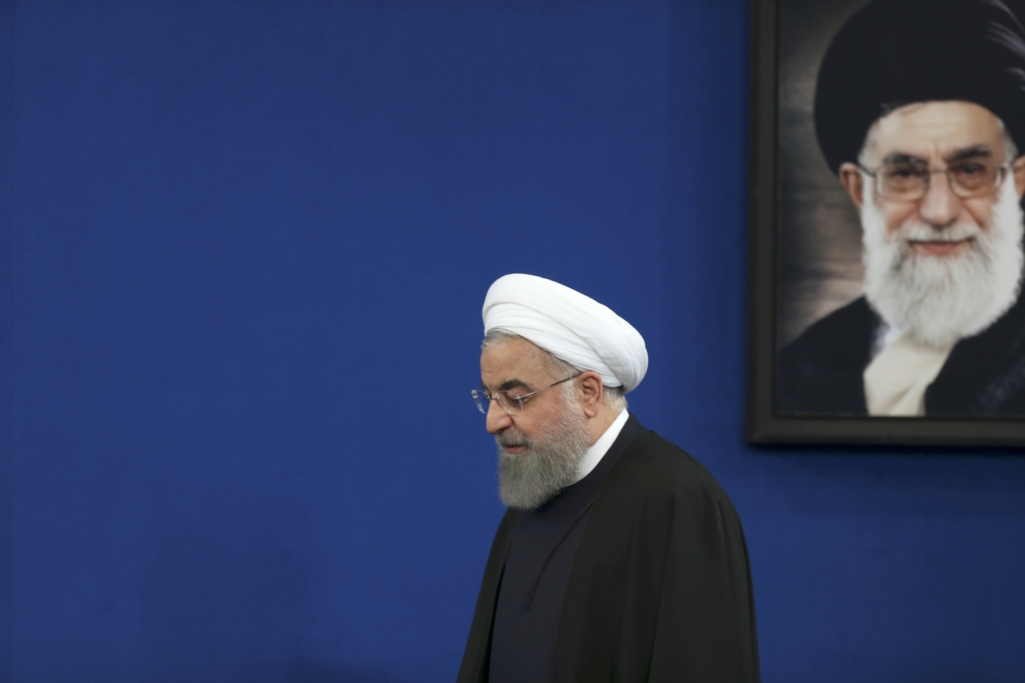 Iranian President Hassan Rouhani arrives for a press conference at the presidency compound in Tehran, Iran. (AP Photo/Vahid Salemi)