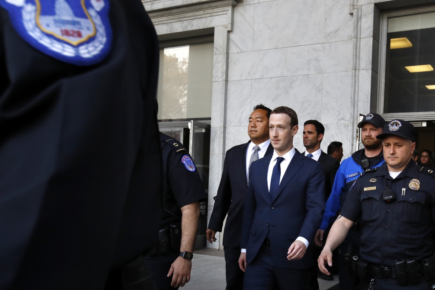 Facebook CEO Mark Zuckerberg leaves the Rayburn House Office Building after testifying on Capitol Hill in Washington on April 11, 2018. (AP Photo/Jacquelyn Martin)