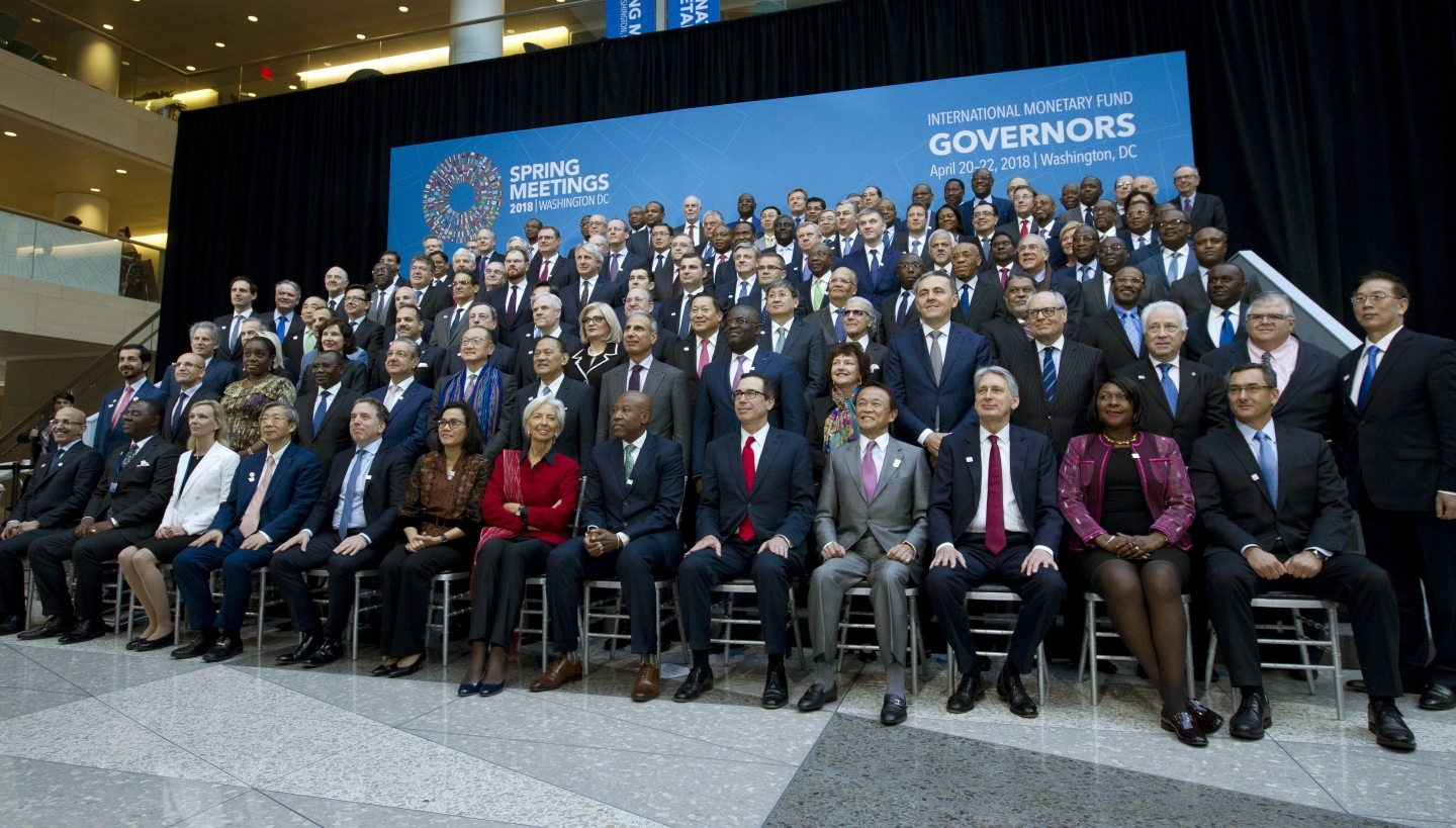 International Monetary Fund (IMF) Governors gather for a group photo during World Bank/IMF Spring Meetings in Washington on April 21, 2018. ( AP Photo/Jose Luis Magana)