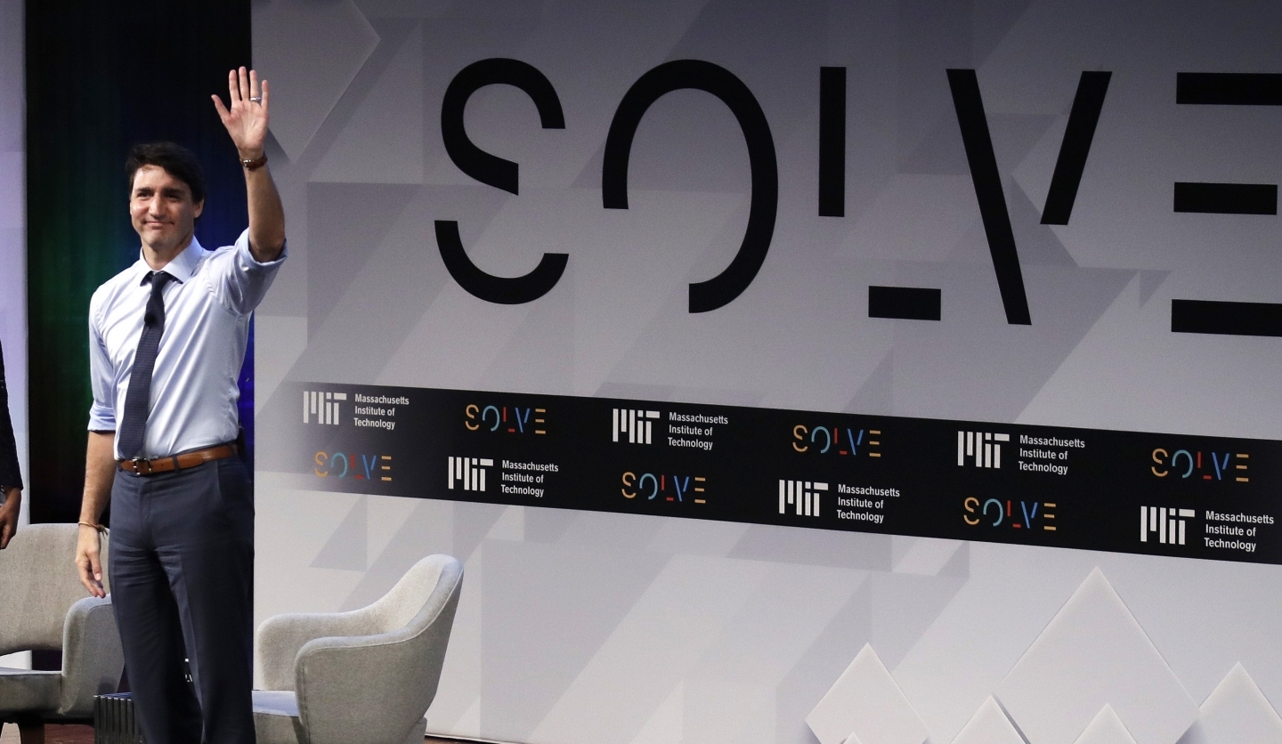 Prime Minister Justin Trudeau waves to the audience as he is introduced during the Massachusetts Institute of Technology's Solve conference at MIT on May 18, 2018. (AP Photo/Charles Krupa)