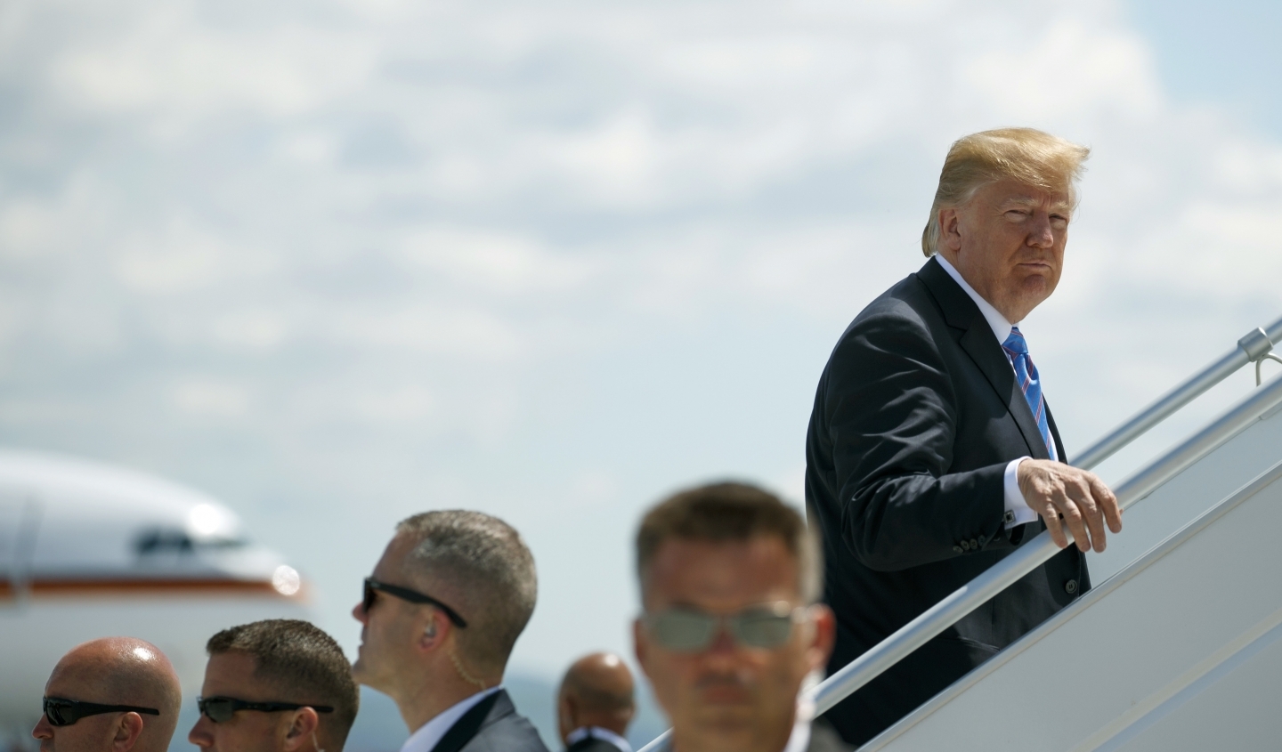 President Donald Trump leaves the G7 summit in Charlevoix, Quebec early for a trip to Singapore to meet with North Korean leader Kim Jong Un. (AP Photo/Evan Vucci)