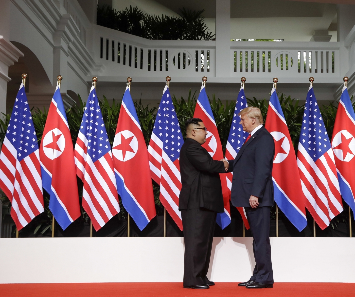 US President Donald Trump shakes hands with North Korea leader Kim Jong Un on June 12, 2018 in Singapore. (AP Photo/Evan Vucci)